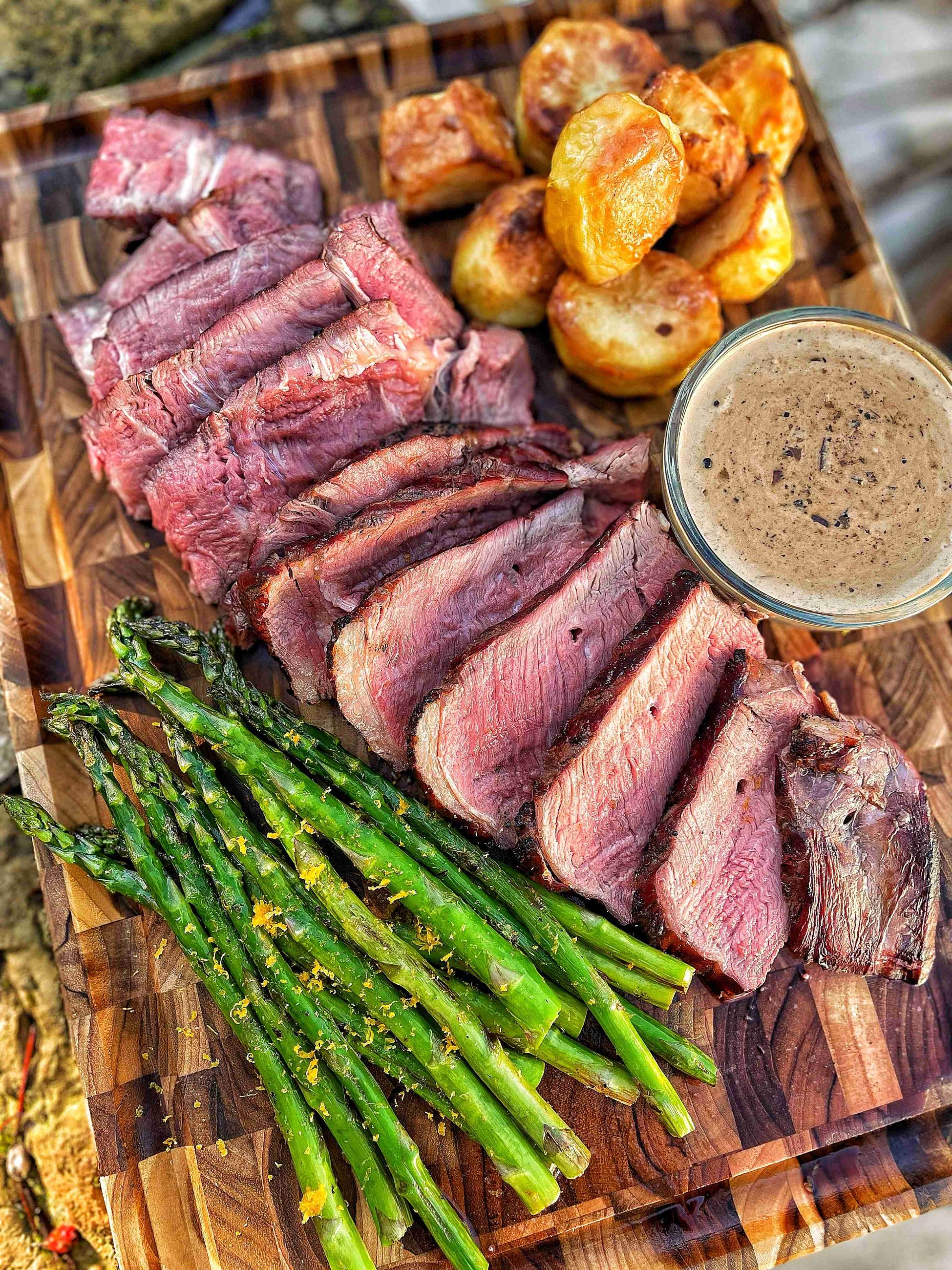 cooked cote de boeuf slice with sides